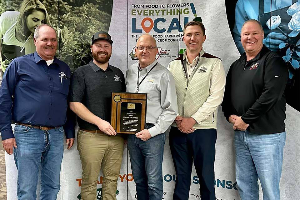 Flamm Orchards family members accepting an award at the Everything Local Conference.